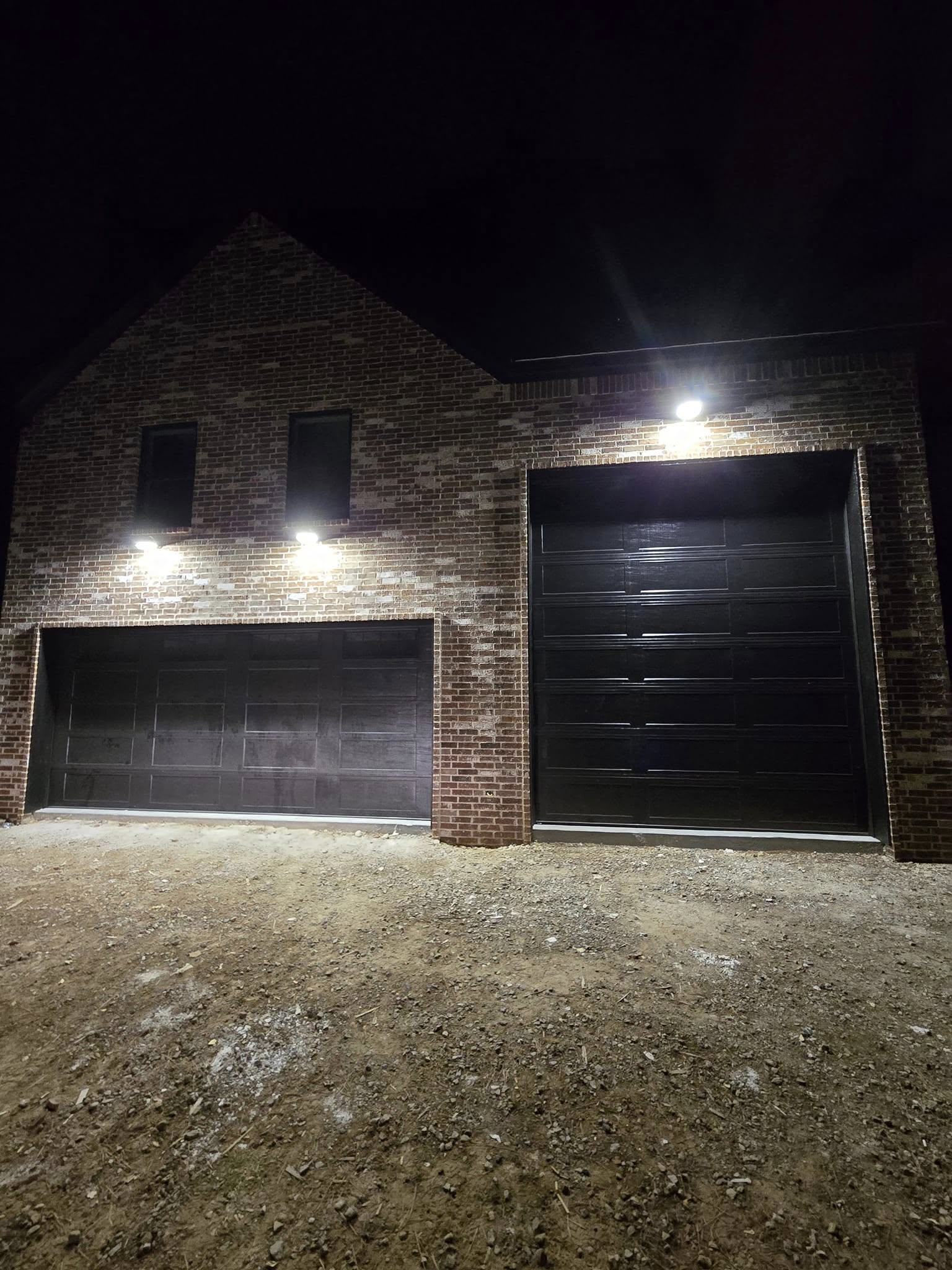Black garage doors installed by ODST Overhead Doors in Northwest Arkansas
